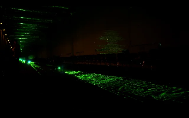 A second view of green light within the dark space.
