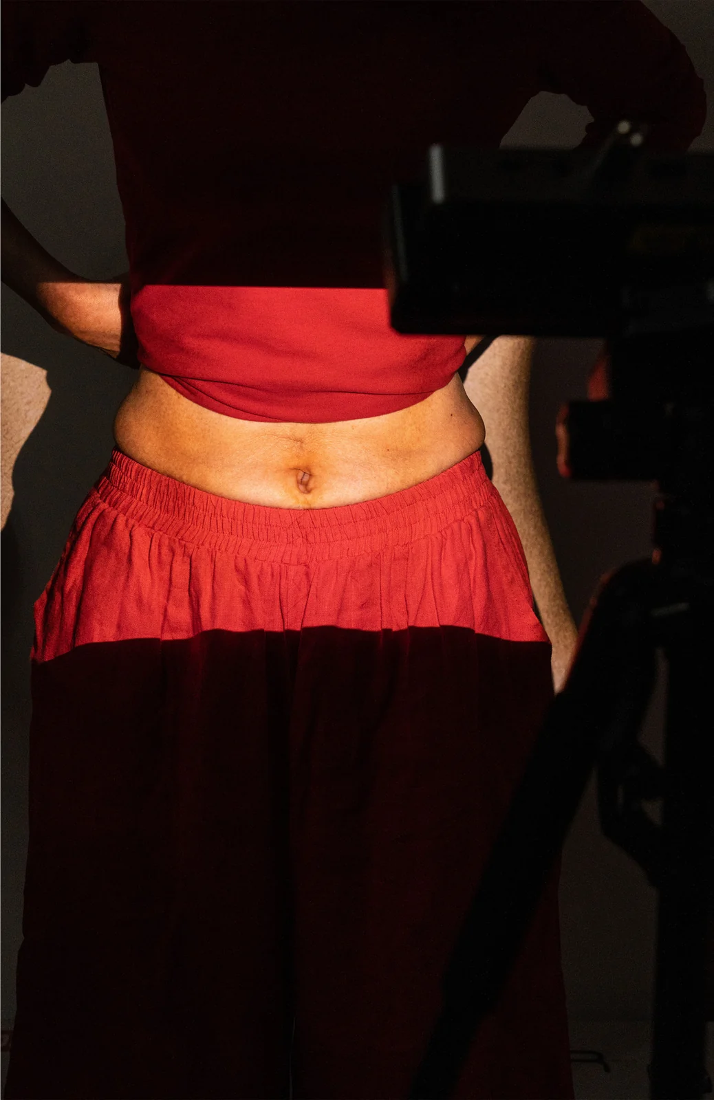 Portrait view of the projection onto the artist’s mother’s belly.